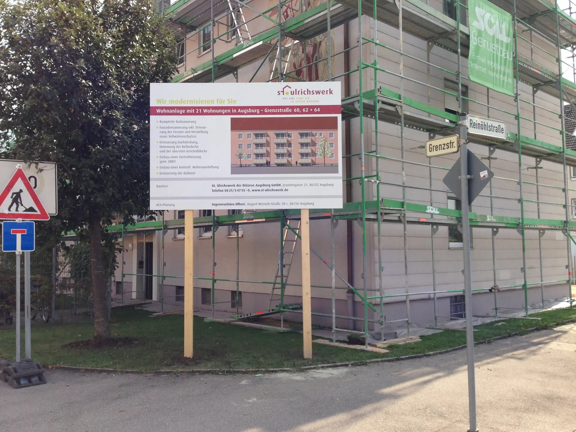 Werbetechnik Dümpel - Augsburg | Augsburg Wohnungsbaustelle - Baugerüst - Grenzstraße Neubaugebiet - Bauschild - Verkehrsschilder.